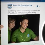 Special Events Gallery - team member posing with a root 66 endo prop in a photo boot